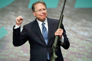 Executive Vice President of the NRA LaPierre holds a 300 Remington Ultra Mag that was auctioned off after he gave the keynote address at the Western Hunting and Conservation Expo in Salt Lake City, Utah
